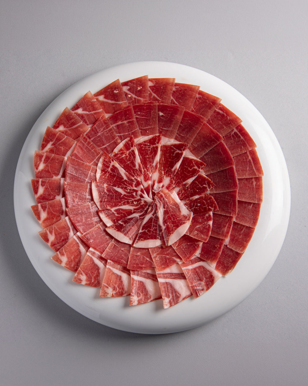PLATO JAMÓN DE BELLOTA 100% IBÉRICO - CORTE A CUCHILLO 100 GR.